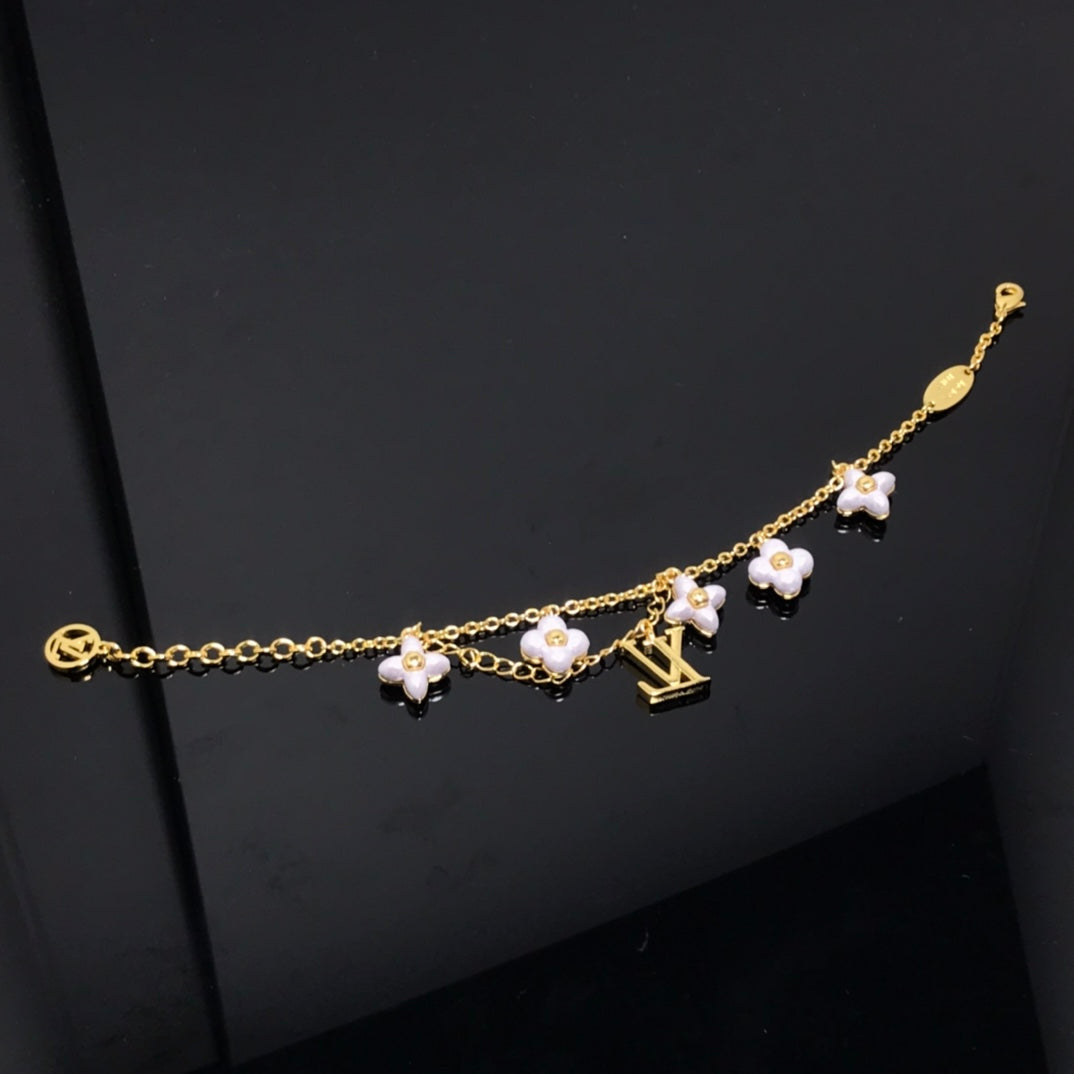 DIANA LOGO 6 MOTIF STAR AND SUN GOLD BRACELET