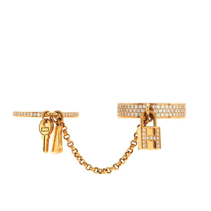 Bague double cloche Diana H.M. Kelly en or rose avec diamants