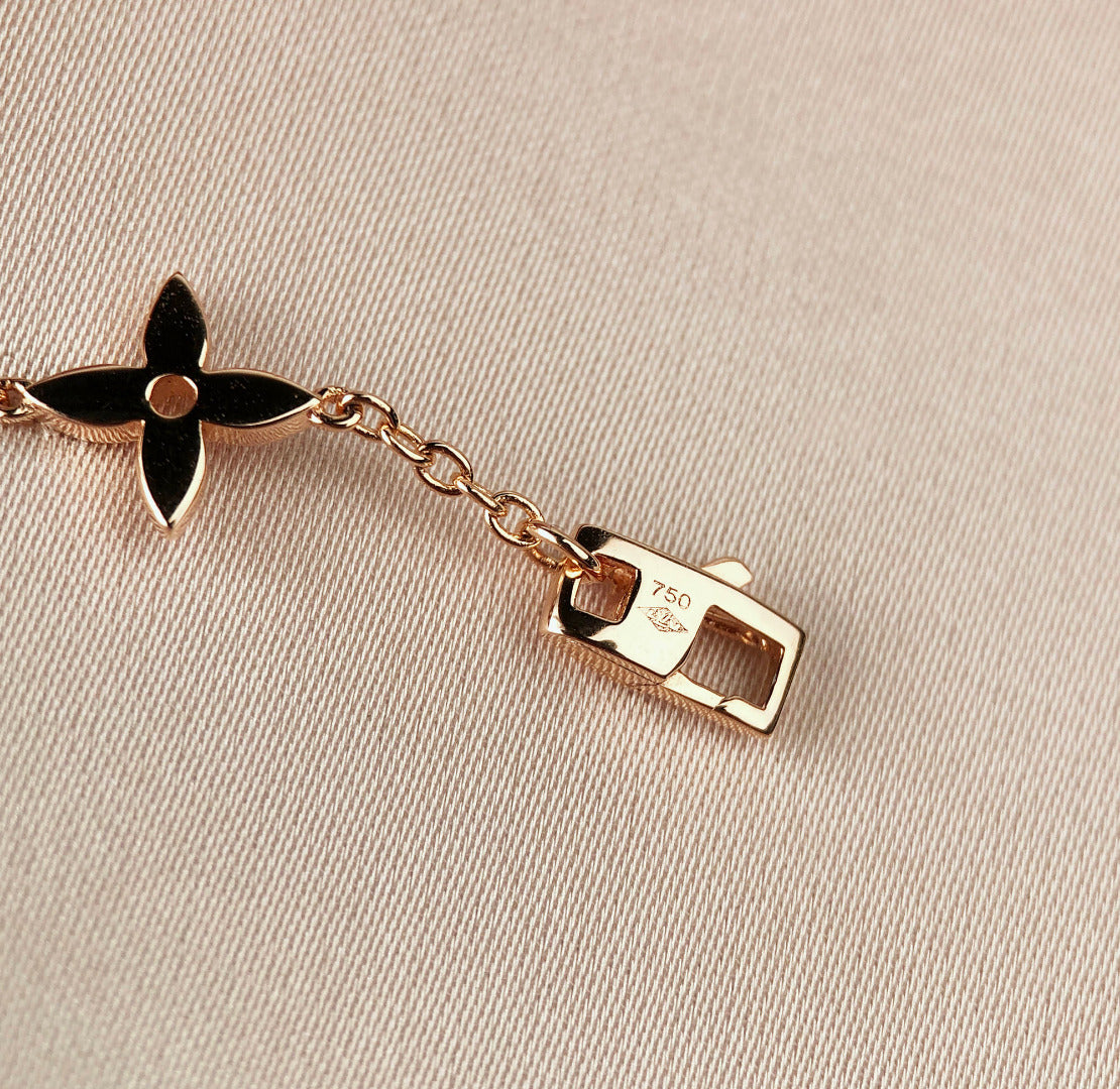DIANA STAR AND SUN 7 MOTIFS GOLD BRACELET