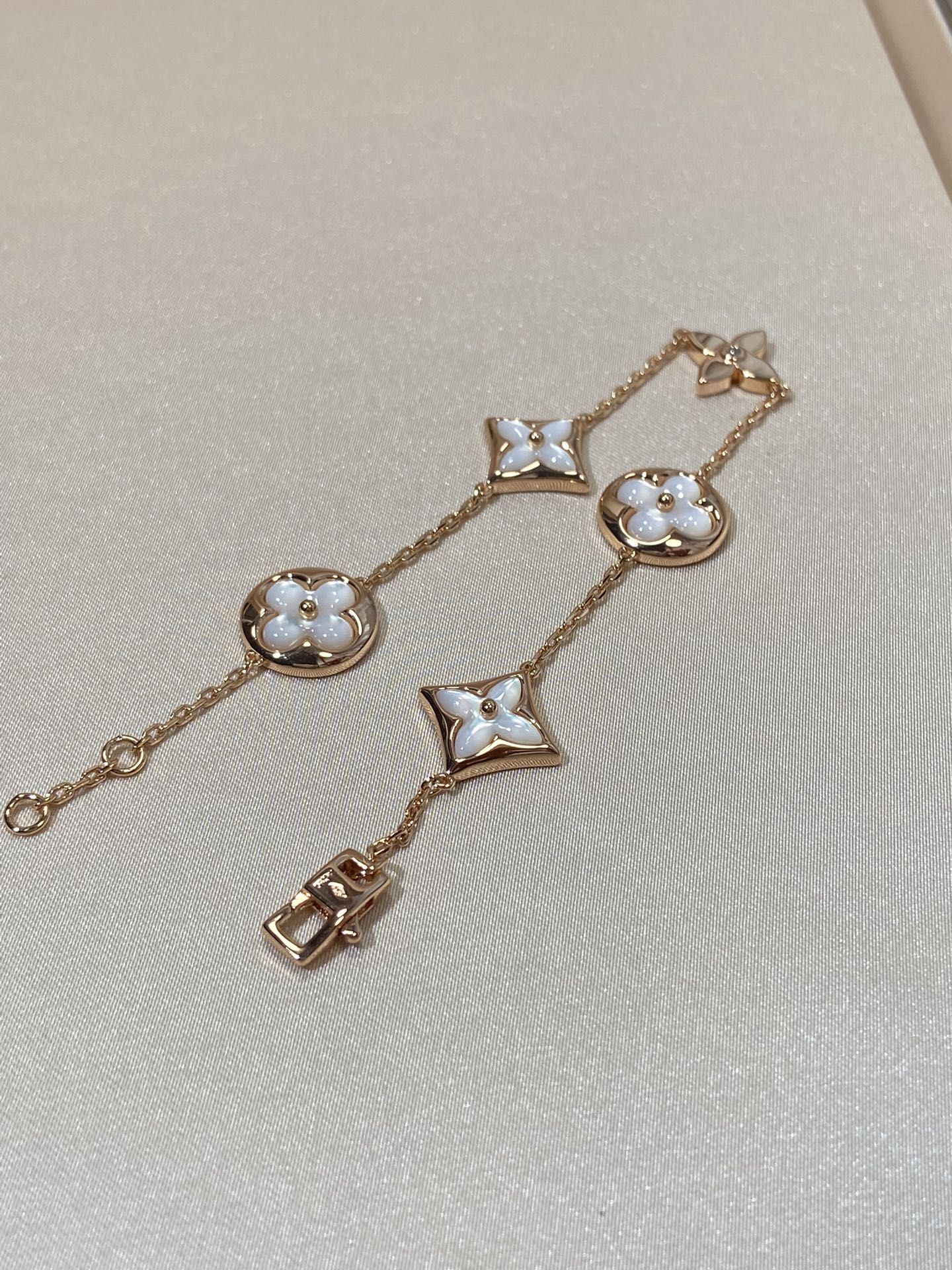 DIANA STAR AND SUN 5 MOTIF MOP PINK GOLD BRACELET