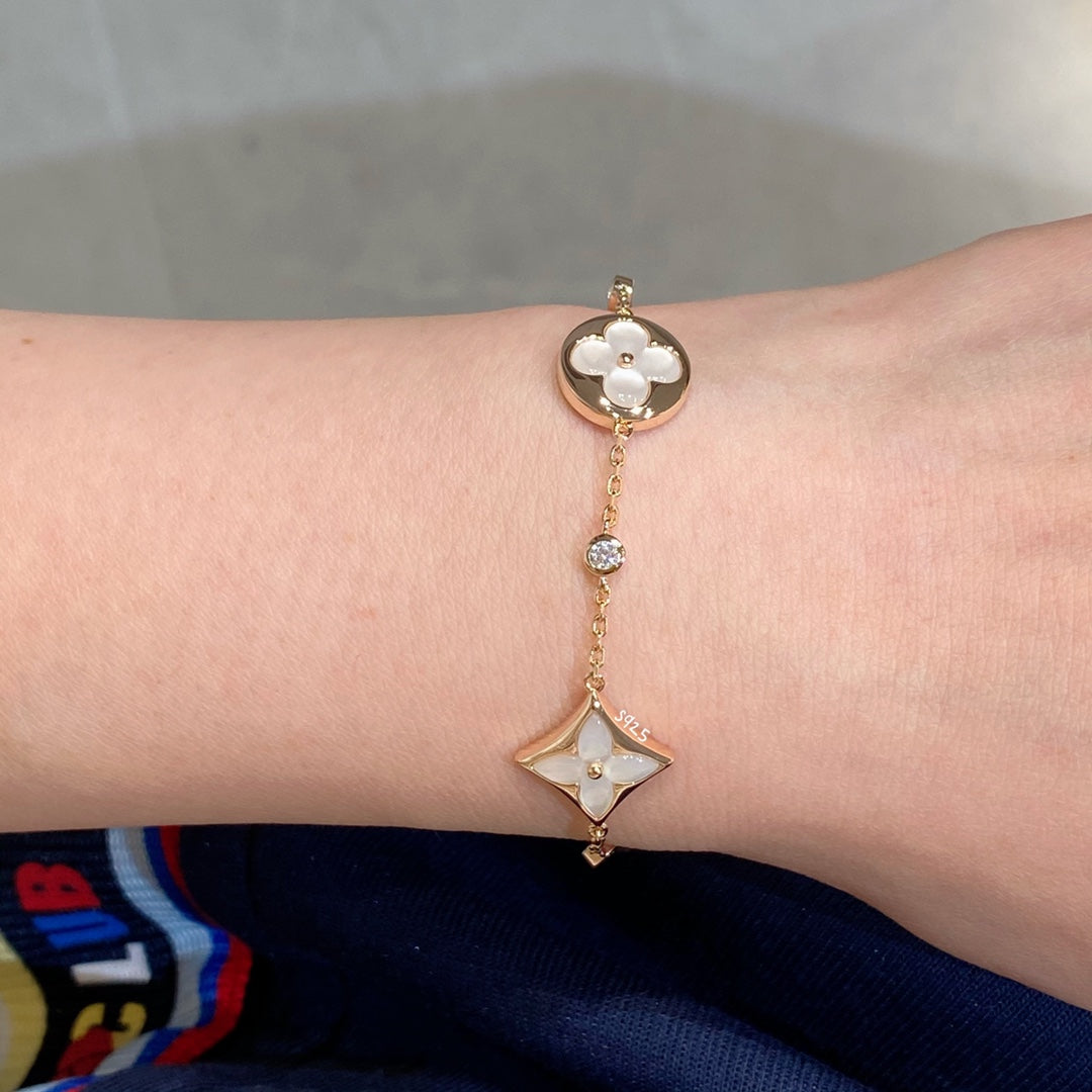 DIANA STAR AND SUN 4 MOTIF WHITE MOP PINK GOLD BRACELET