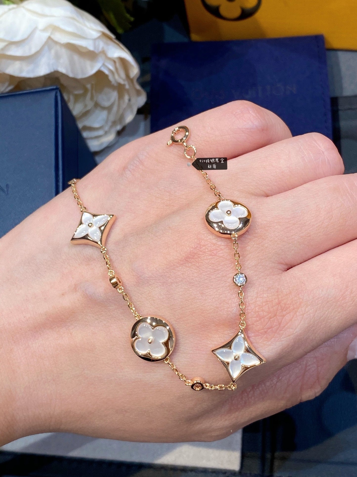DIANA STAR AND SUN 4 MOTIF WHITE MOP PINK GOLD BRACELET