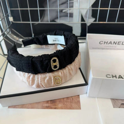 BLACK FABRIC WITH GOLD LOGO HAIRBAND 414448