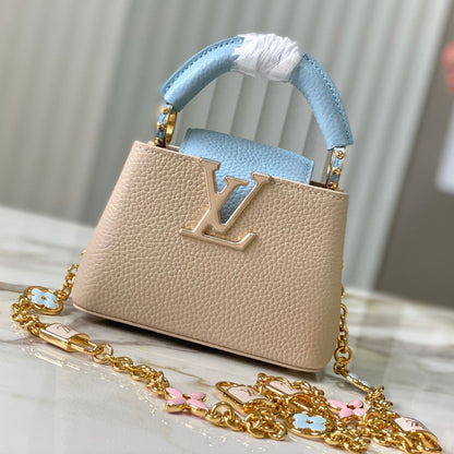 capucines nano 16 beige cloud blue taurrilon leather gold hardware